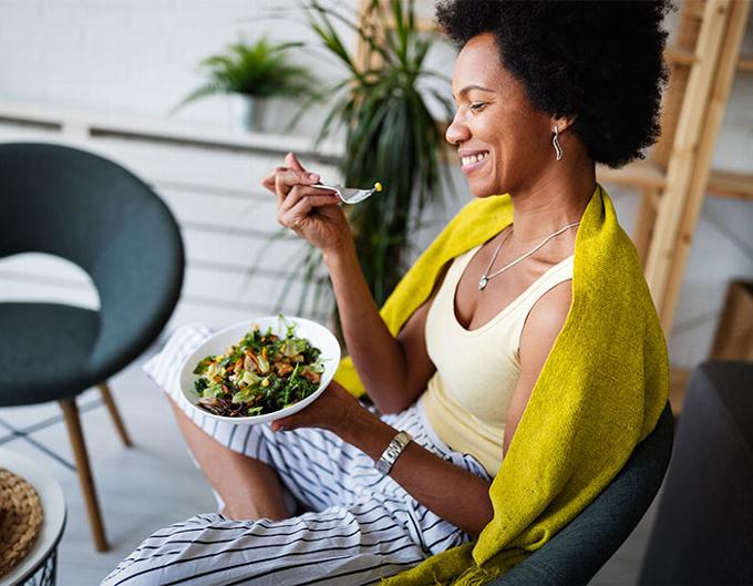 Lady eating healthy foods in lounge